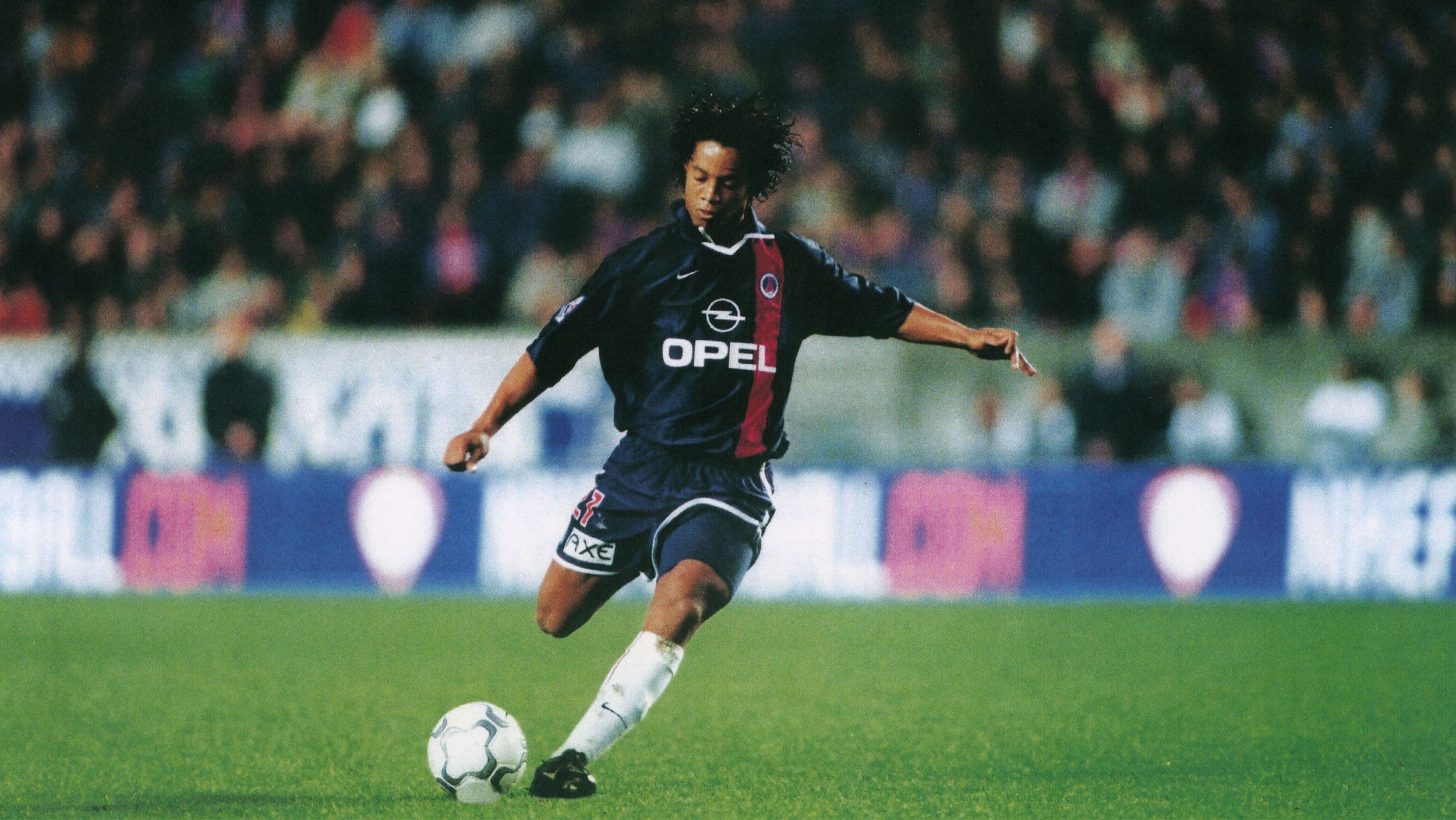 Ronaldinho gets ready to strike the ball in his 2001-02 debut season for PSG.